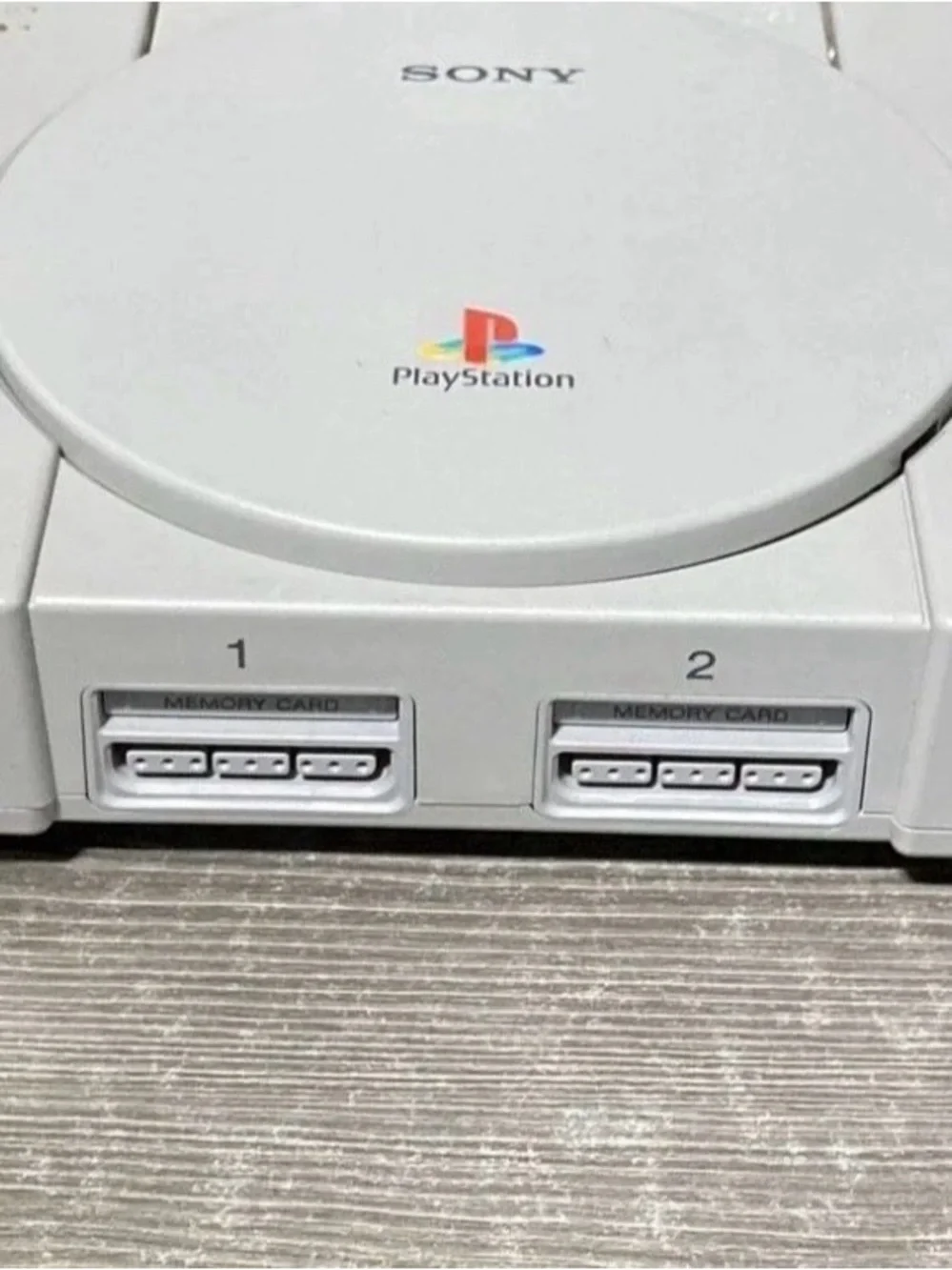 Sony Gray PlayStation Console with Matching Gray Controller and Cables